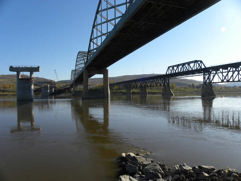 From the eastern bank of the Peace River, the new piers await arrival of the deck