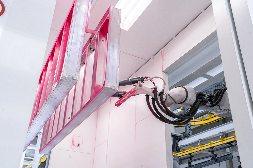 Automatic, digital and flexible: Doka’s new powder-coating plant selects the right powder application method, such as the robot hand,  to suit a client’s needs (image courtesy Doka)