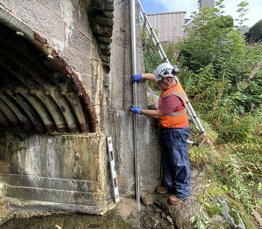 Installation of an OTT ecoLog 1000 water level logger in a stilling well with cellular data connection to Hydromet Cloud for the Vales Burn bridge trial in Scotland (image courtesy OTT HydroMet/Transport Scotland) 