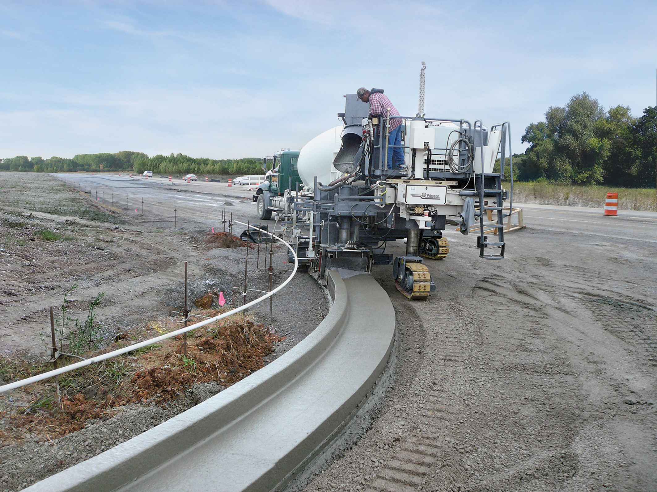 Wirtgen's new SP15 pouring curved barrier