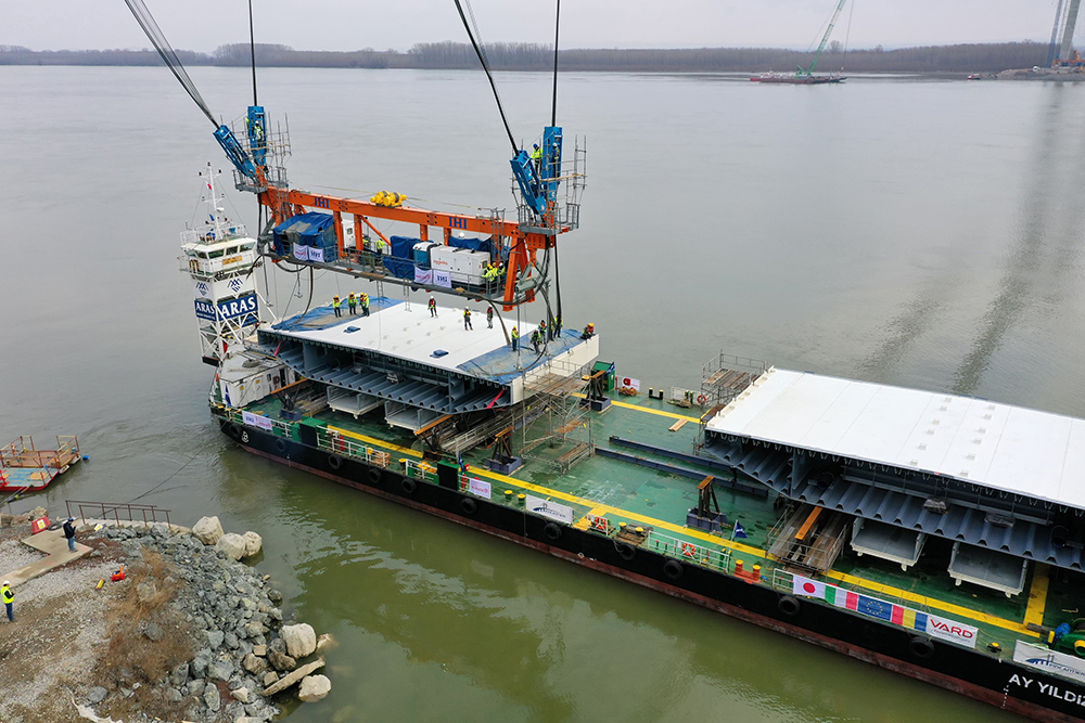Two segments have been delivered at a time from the shipyard on barges