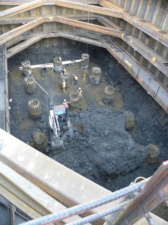 Pile work inside a coffer dam for pier construction: removal of walers would later prove challenging