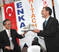 Mr Hironori Okajima presented ENKA Pazarlama's Ali Kara with a model of a large Hitachi excavator