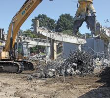 Hydraulic demolition shears at work at Presidio Parkway 