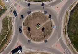 The lamps poles - which are casting long black shadows - are located only on the roundabout island and at a bicycle crossing (image courtesy NIF)