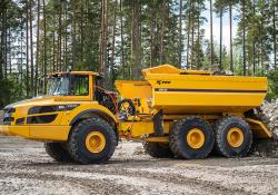 EJB4X Ejector Body on the back of a Volvo A45G articulated hauler allows safe ejection material in areas where overhead clearance is low