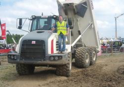 Man standing on Terex dump truck 