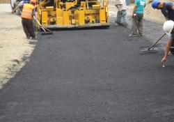 workers smothing tarmac