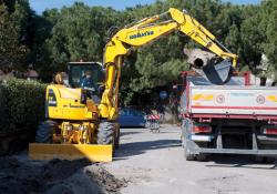komatsu excavator filling truck