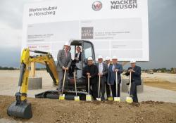 A silver spade ceremony marks the start of construction at the new Wacker Neuson plant