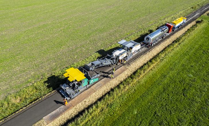 Granulation, mixing and paving in a single pass: the Wirtgen Group cold recycling train sustainably and efficiently rehabilitated an agricultural road in the Netherlands while saving resources.